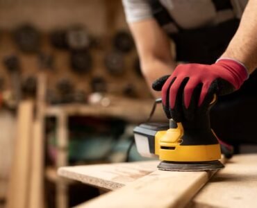 carpenter-cutting-mdf-board-inside-workshop_23-2149451032