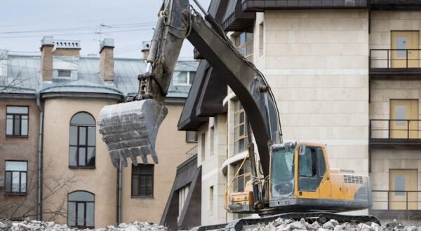 demolition-building-using-special-hydraulic-excavator-destroyer_165285-752